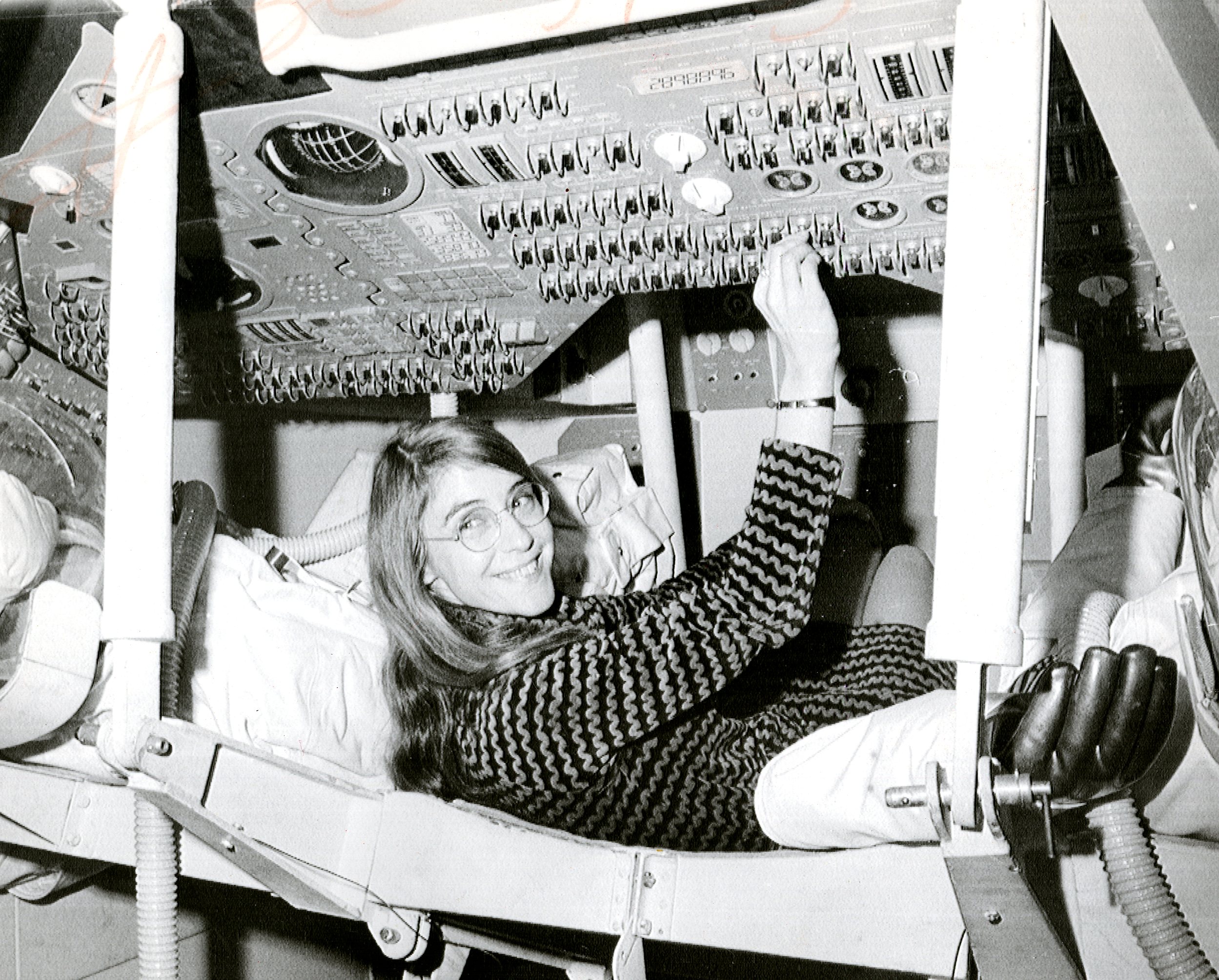 Margaret Hamilton, lead Apollo flight software engineer, in the Apollo Command Module.